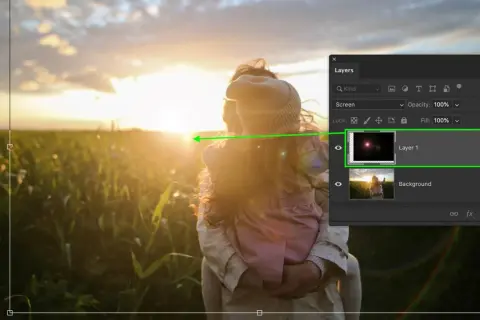 Effetto lens flare in Photoshop su un tramonto con due persone.