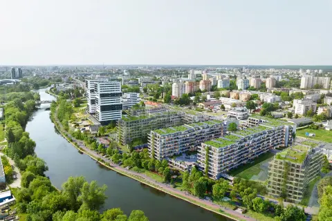 Nowoczesne osiedle apartamentowe z zielonymi dachami nad rzeką w Bydgoszczy.