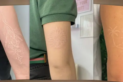 Drei Arme mit filigranen weißen Tattoos: eine Rose mit Blättern, eine Gänseblümchen und eine Palme.