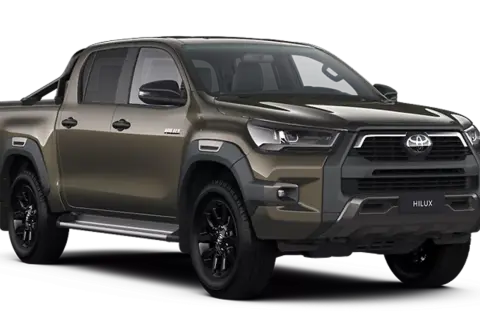 Brązowy Toyota Hilux z czarnymi felgami i relingami. Sprawdź aktualną toyota hilux cena i zamów swój wymarzony samochód.