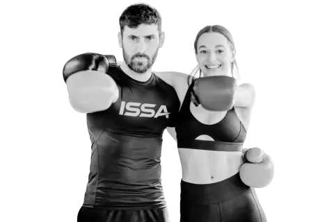 A man and woman in boxing gloves ready to punch, embodying the intensity of hiit boxing.