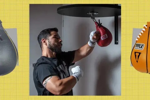 A boxer practices speed bag combos with a red Title bag. An Everlast bag is on the left, and an orange Title bag on the right.