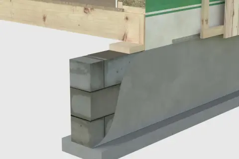 Detaljerad vy av syll på betongplatta med isolering och trästomme.