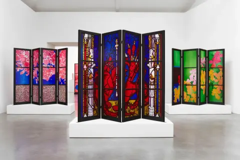 A triptych of stained glass screens, showcasing vibrant floral and mythical scenes, reminiscent of the work of famous stained glass artists.