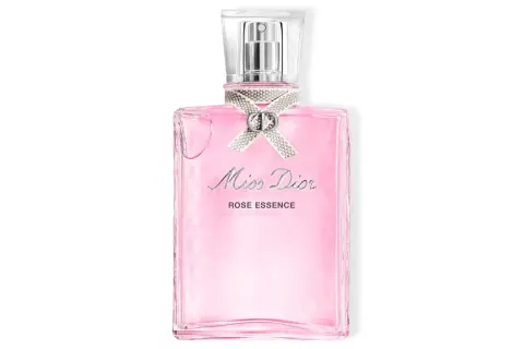 Różowa butelka Miss Dior EDT z ozdobną kokardką i logo CD. Zapach Rose Essence.