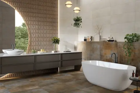 Baño moderno con bañera exenta y lavabo doble. La diferencia entre baldosa y azulejo se aprecia en las paredes, unas lisas y otras con relieve.
