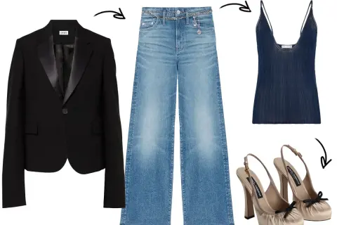 Outfit blazer e jeans: giacca nera con revers in raso, jeans a vita alta a zampa, top blu scuro e décolleté beige con fiocco.