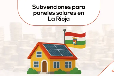 Casa con paneles solares y bandera de La Rioja, rodeada de pilas de monedas. Ayudas placas solares La Rioja.