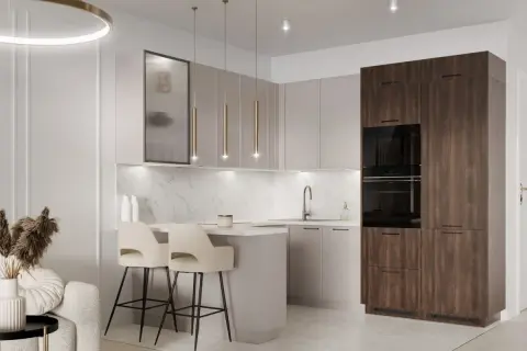 Elegancka kuchnia modern classic z wyspą, dwoma hokerami i wysoką zabudową z piekarnikami.