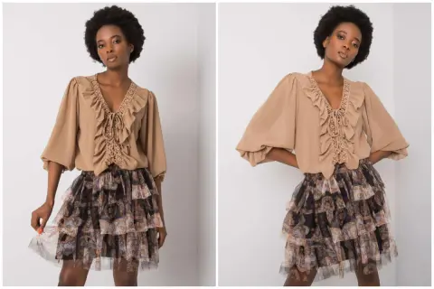 Modelka w bluzce z falbankami i koronką oraz zwiewnej spódnicy z falbanami w stylu boho.