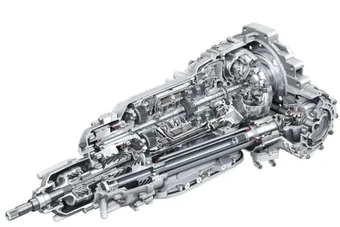 Przekładnia z mechanizmem różnicowym torsen, pokazująca skomplikowane koła zębate i wały napędowe.