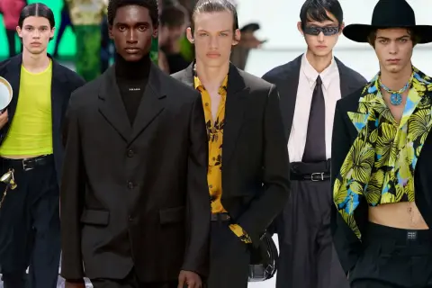Modelli con abito nero uomo, camicia colorata e cravatta. Stili diversi per un look audace.