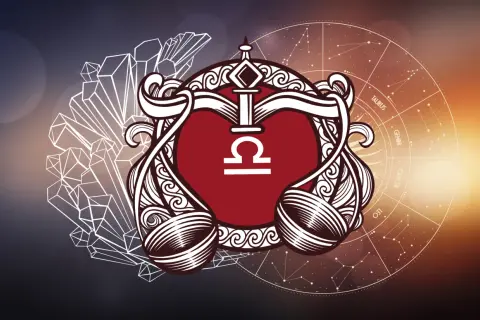 Symbol Wagi, rodonit znak zodiaku, otoczony kryształami i kołem zodiaku.