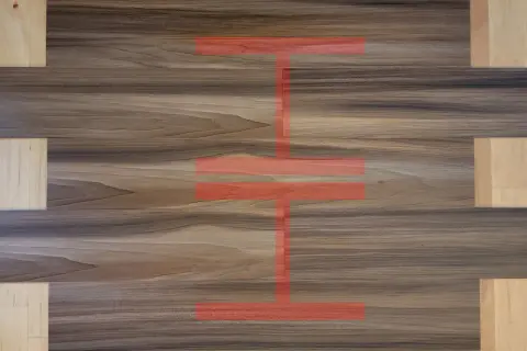 Visual guide on how to measure for LVP flooring. The image shows wood-look planks with a red overlay highlighting measurement points.