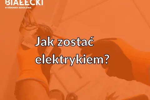 Ręce w pomarańczowych rękawicach podłączają przewody elektryczne.