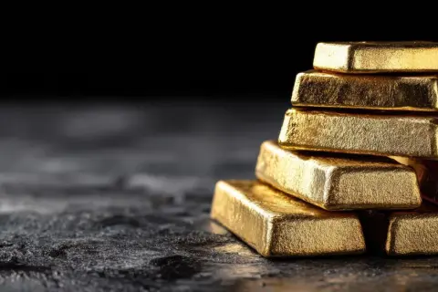 Una pila de lingotes de oro relucientes, tan valiosos que incluso el oro se raya.