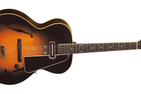 Klasyczna gitara elektryczna z wycięciami w kształcie litery "f", z przetwornikiem i kluczami. Może to być pierwsza gitara elektryczna, która rozpoczęła rewolucję w muzyce.
