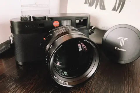 Leica M8 camera with a TTArtisan 50mm f/0.95 lens. The lens has "50/0.95" clearly visible.