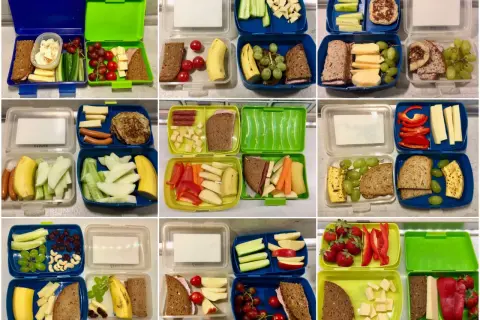 Bunte Brotdosen für den Kindergarten: gesunde und ungesunde Lebensmittel wie Obst, Gemüse, Käse, Wurst und Brot.