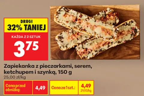 Zapiekanka z pieczarkami, serem i szynką na desce, z promocją 32% taniej.
