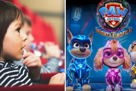 Ein Kind im Kino schaut gespannt auf die Leinwand, auf der die Helden von Paw Patrol – Der Kinofilm zu sehen sind.