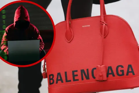 Haker w czerwonej bluzie z kapturem przy laptopie, obok czerwona torebka z napisem BALENCIAGA. Czy to balenciaga co to za firma?
