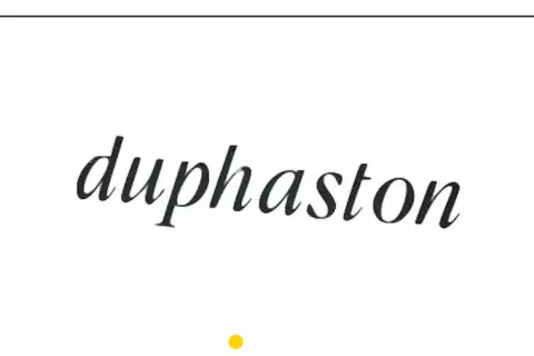 Napis "Duphaston" w eleganckiej czcionce, często stosowany w ciąży.