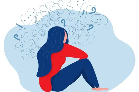 En person sitter med huvudet i händerna, omgiven av kaos. Kan en psykolog sjukskriva? Ja, vid psykisk ohälsa.