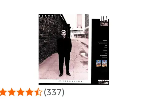 Okładka albumu "Wonderful Life" zespołu Black. Mężczyzna w czarnym garniturze stoi na ulicy.