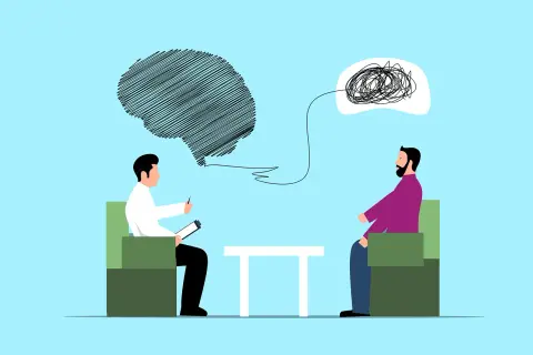 Terapia pomaga uporządkować myśli i jak poprawić swoją psychikę. Terapeuta słucha pacjenta, który ma splątane myśli.