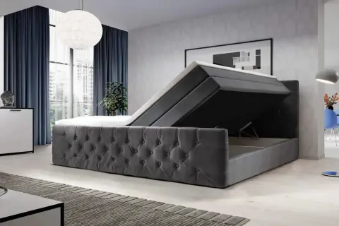 Modernes Boxspringbett mit Stauraum. Der Bezug ist aus grauem Samt, die Matratze ist hochgeklappt. Vielleicht ist das Boxspringbett zu hart?