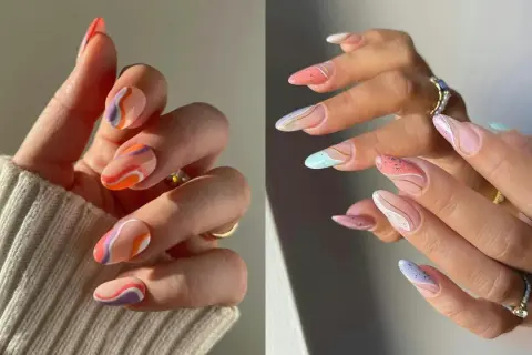 Manucure aux motifs abstraits et ondulés, un nail art vague coloré et pastel avec des touches dorées.