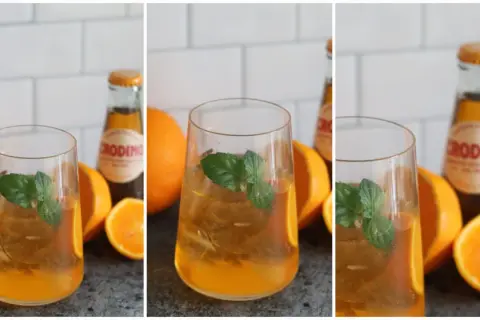 Erfrischender Crodino Spritz mit Eis, Minze und Orangenstücken. Perfekt für einen sonnigen Nachmittag.