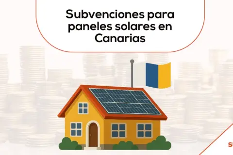 Casa con paneles solares y bandera canaria, rodeada de pilas de monedas. Subvenciones para placas solares en Canarias.