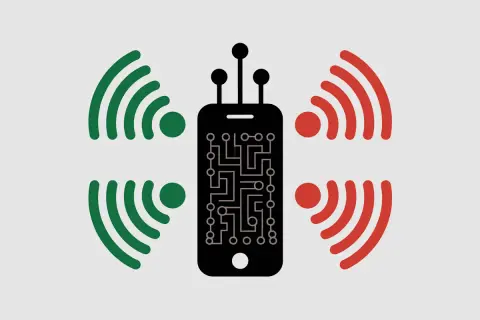Smartphone noir avec circuit imprimé, entouré de signaux verts et rouges. L'iPhone 11 est-il 5G ou pas ?