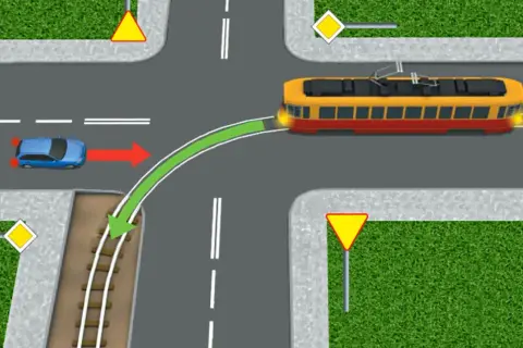 Na skrzyżowaniu, kiedy tramwaj ma pierwszeństwo, niebieski samochód musi ustąpić mu drogi, zgodnie z zieloną strzałką.