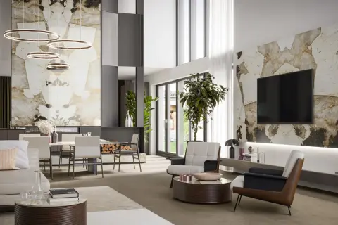 Elegante salotto e sala da pranzo con pareti in pietra naturale, mobili moderni e illuminazione a sospensione.