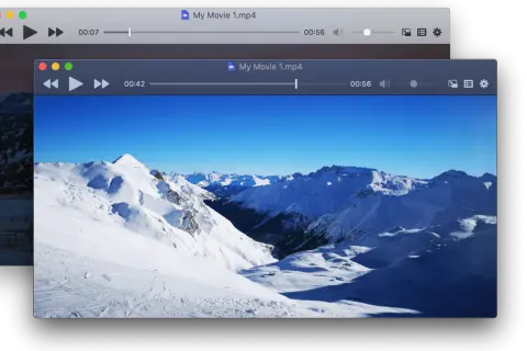 Two iina windows display a snowy mountain landscape. The front window shows a movie player with a ski resort scene.
