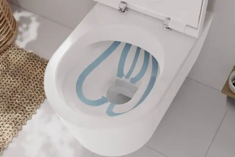 Biała miska WC z widocznym schematem przepływu wody w kolorze niebieskim.