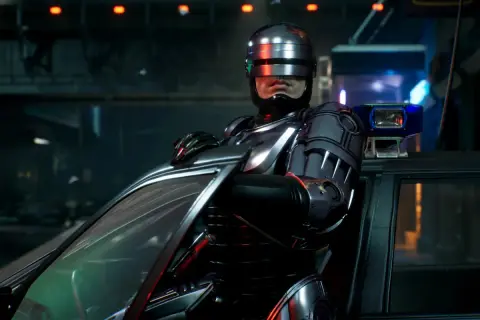 RoboCop w zbroi opiera się o samochód, gotowy do akcji w grze RoboCop: Rogue City.