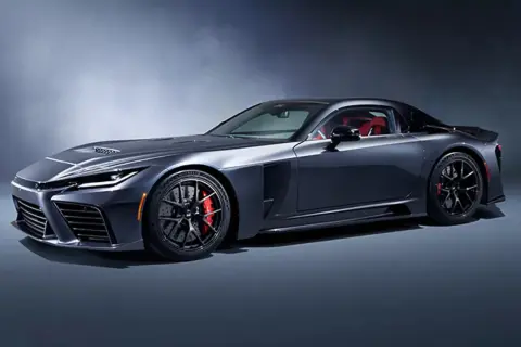 Ciemnoszara Toyota GR Supra MK5 z czerwonym wnętrzem, na tle studyjnym.