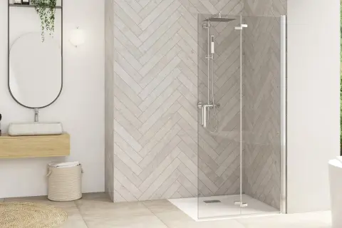 Salle de bain moderne avec paroi de douche en verre, idéale pour enlever calcaire paroi douche. Double vasque et baignoire invitent à la détente.