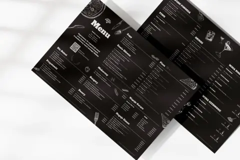 Menu z daniami a la carte, napojami i winami. Elegancki czarny design z białymi napisami i ilustracjami.