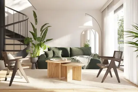 Nowoczesny salon z zieloną sofą i drewnianymi meblami. Idealne miejsce na wakacyjny **wynajem apartamentów nad morzem**.