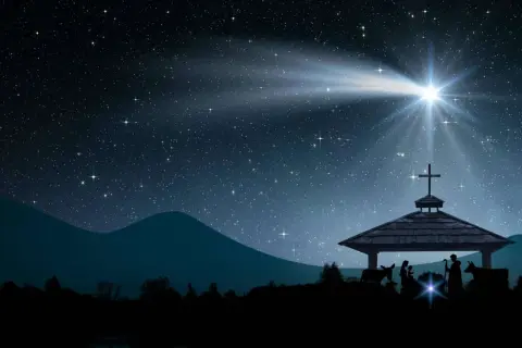 Sternenklare Nacht über der Krippe. Der helle Weihnachtsstern leuchtet und symbolisiert Hoffnung und Neuanfang. Maria, Josef und das Jesuskind sind im Stall zu sehen.
