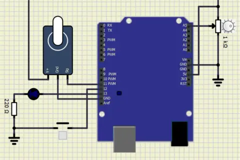 Symulator elektroniki: Arduino z potencjometrem, diodą, rezystorem 220 Ω i przyciskiem.