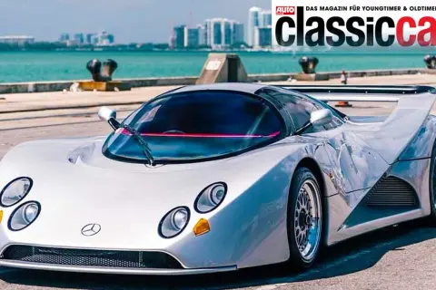 Silberner Lotec C1000 Supersportwagen mit markantem Heckspoiler und futuristischem Design, bereit für die Rennstrecke.