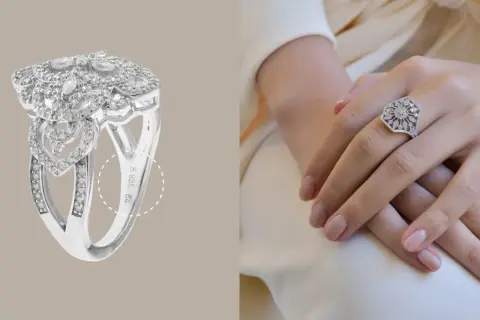 Anillo de plata 925 con incrustaciones de diamantes, con un diseño floral y de corazones. La marca de plata 925 es visible.