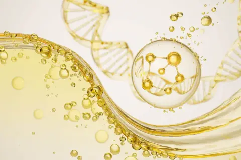 Złote kropelki i struktura DNA, w centrum molekuła peptyd miedziowy w bańce.