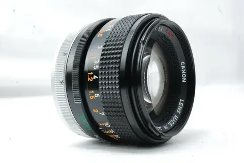 A Canon 50mm f/1.4 SSC lens, a contender for the best Canon FD lens, showcasing its aperture and focus rings.